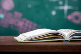 Open book with chalkboard background